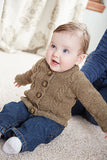 A sweet baby wearing a chic, brown buttoned sweater with raglan neckline.